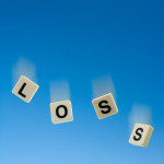 Loss falling with blue sky background.