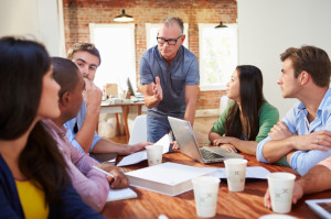 Group Of Office Workers Meeting To Discuss Ideas