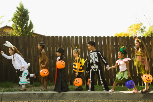 Children In Halloween Costumes Holding Hands Picture Id85651826