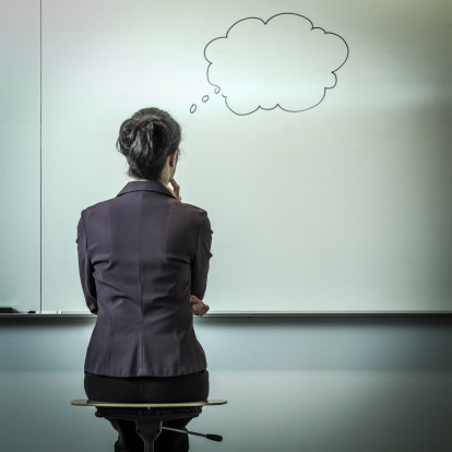 Filipino Businesswoman With Thought Bubble In Office Picture Id187139474