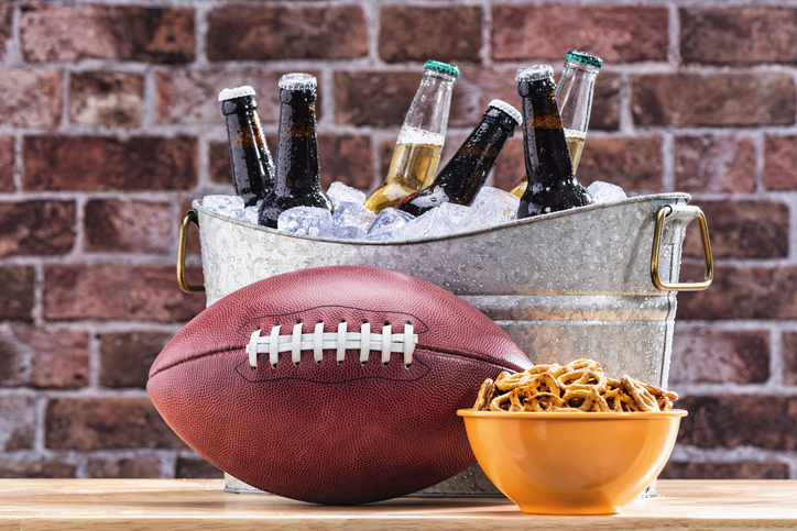 Football With Bowl Of Pretzles And Bottles