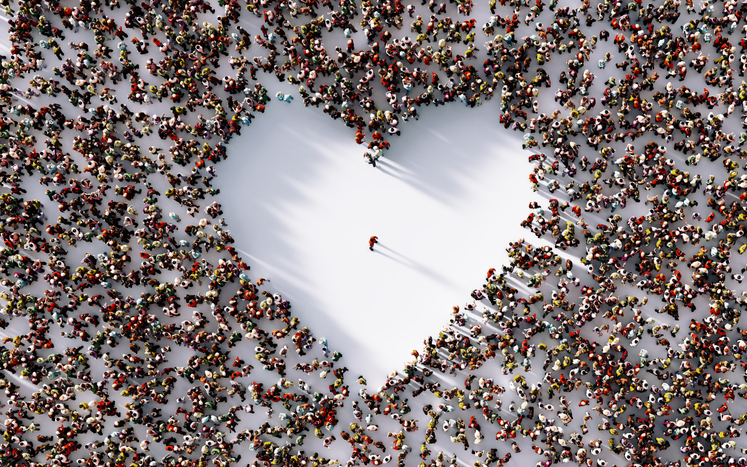 Person In Middle Of A Heart Shaped Void Surrounded By People