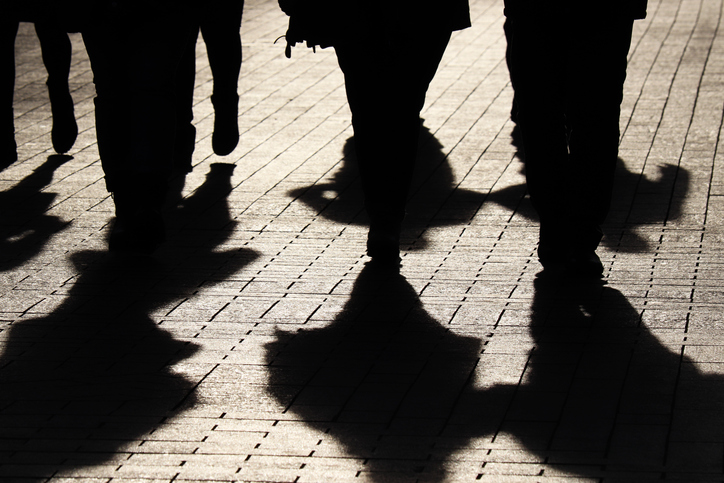 Silhouettes And Shadows Of People On The Street