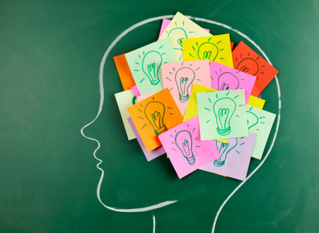 Head On Chalkboard With Light Bulb Notes Inside