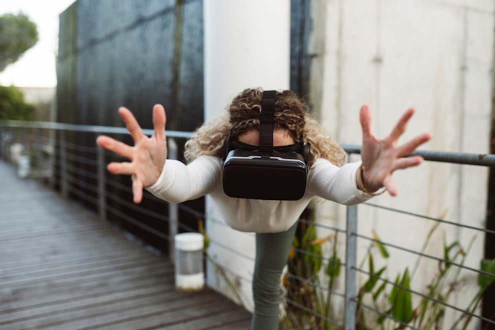 Practices Yoga Outdoors, With Virtual Reality Glasses