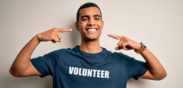 A volunteer smiling.