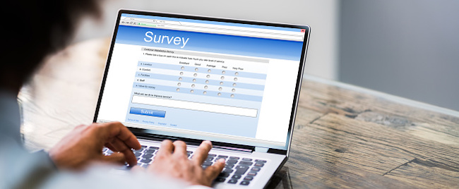 Online Survey Form. Man Filling List On Laptop Computer