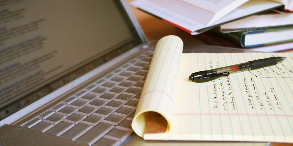 Laptop Open To Search Engine Results Paper Full Of Notes