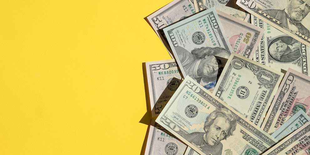 Monetary Incentives On Yellow Background