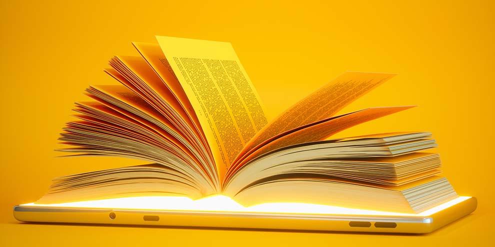 Open Book On Top Phone Yellow Background