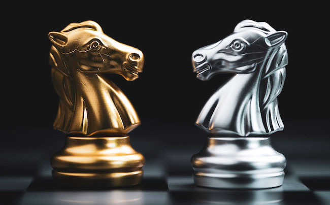 Gold and silver chess pieces.