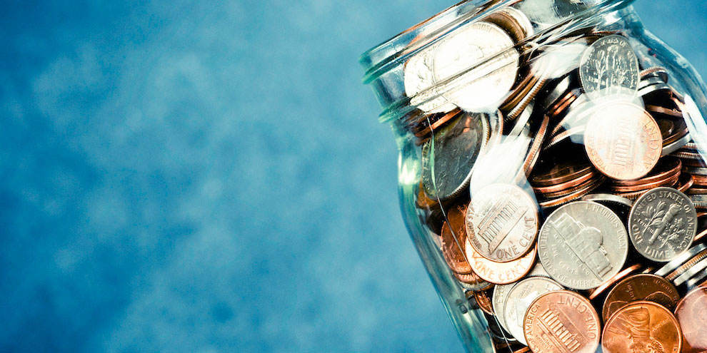 A mason jar full of coins.