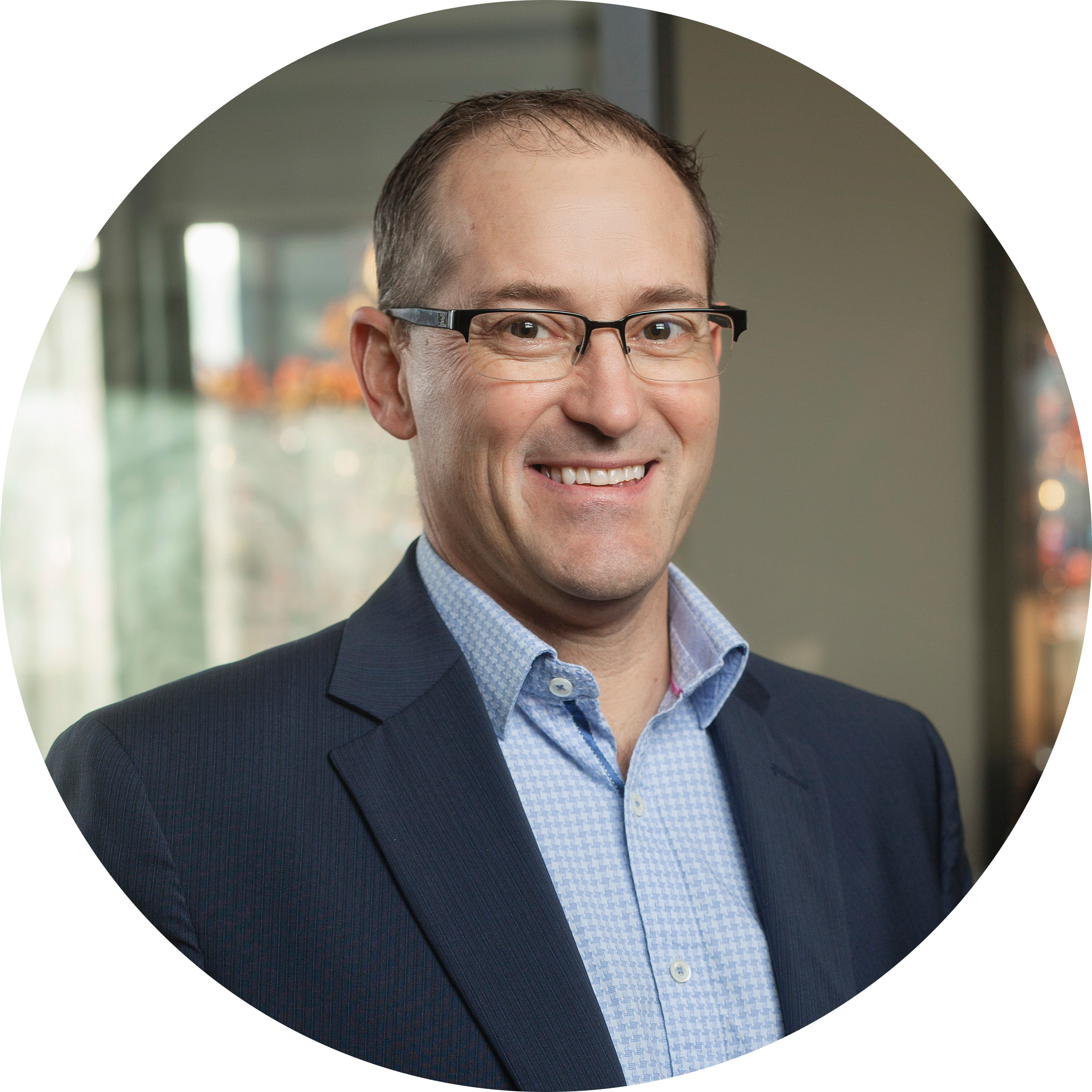 Mike Linck’s headshot on a grey background with a slight white boarder.