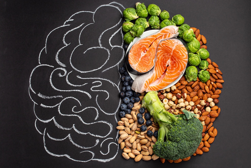 A brain comprised of half of a drawing and half healthy food.