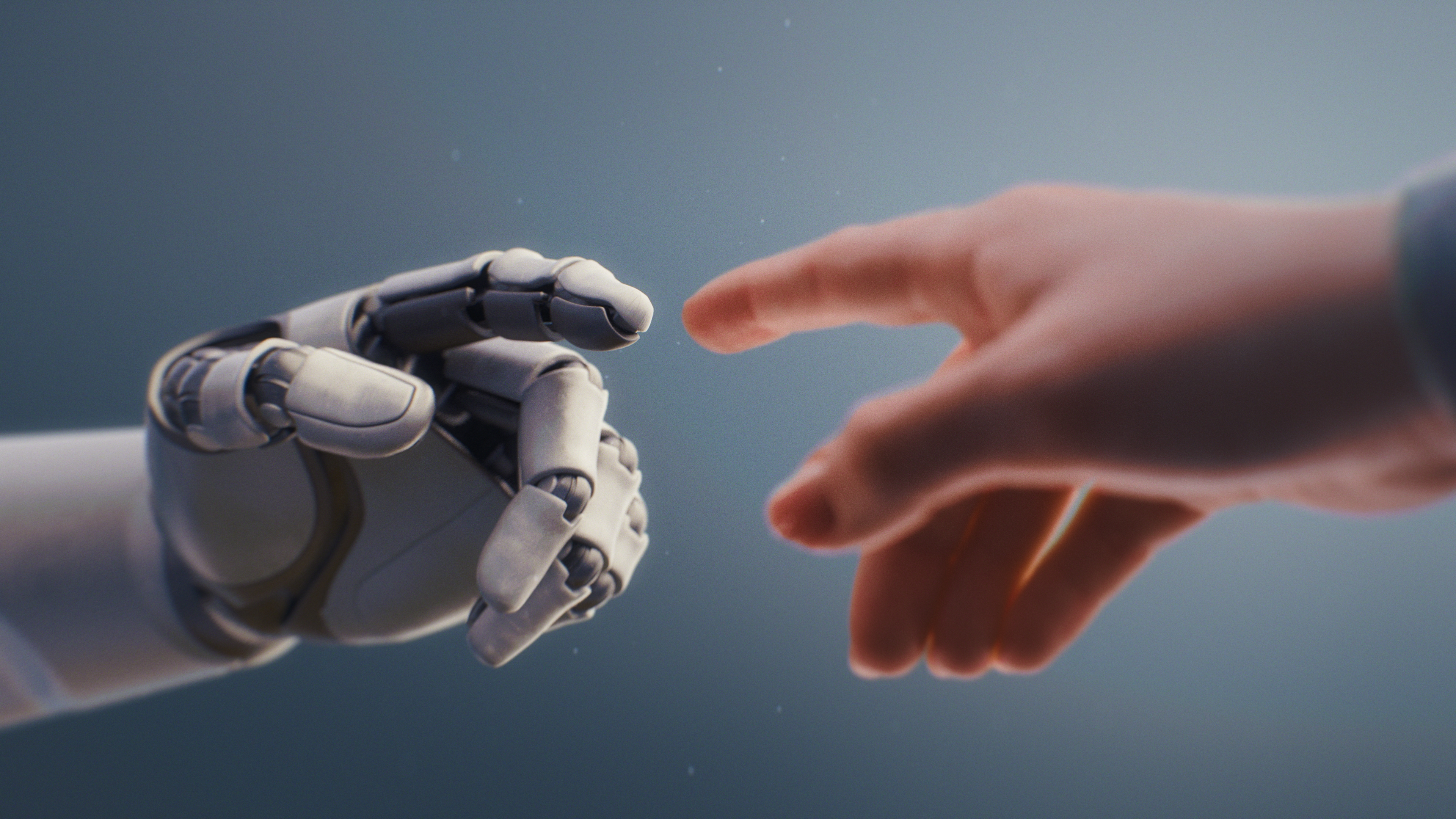 Human finger reaching out to a robot finger